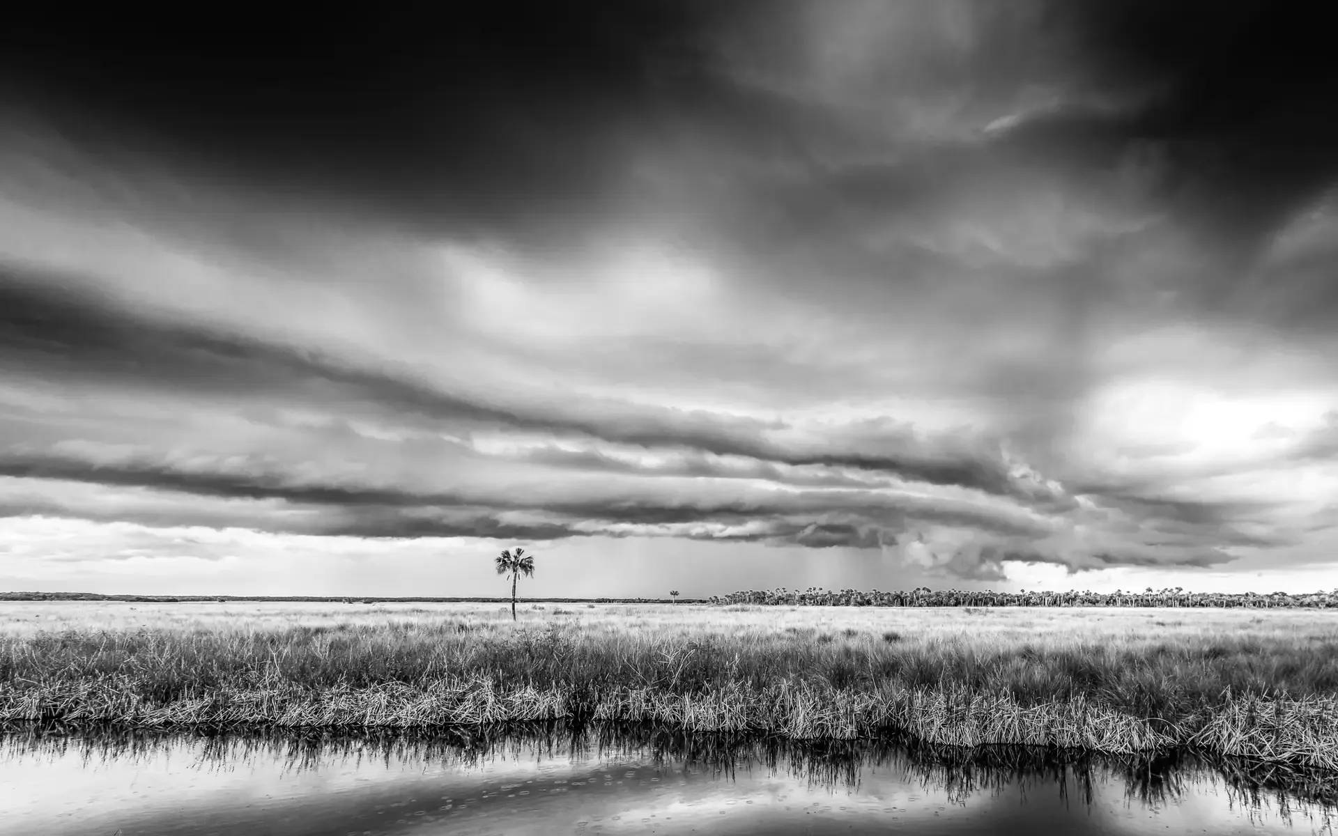 Dramatic clouds over serene landscape