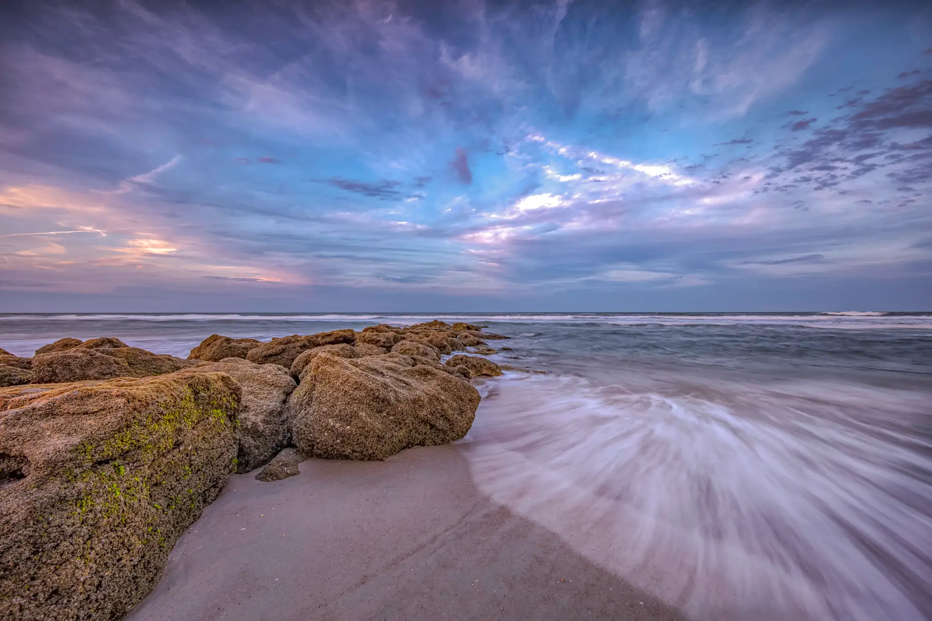 Serene beach with rocky shoreline