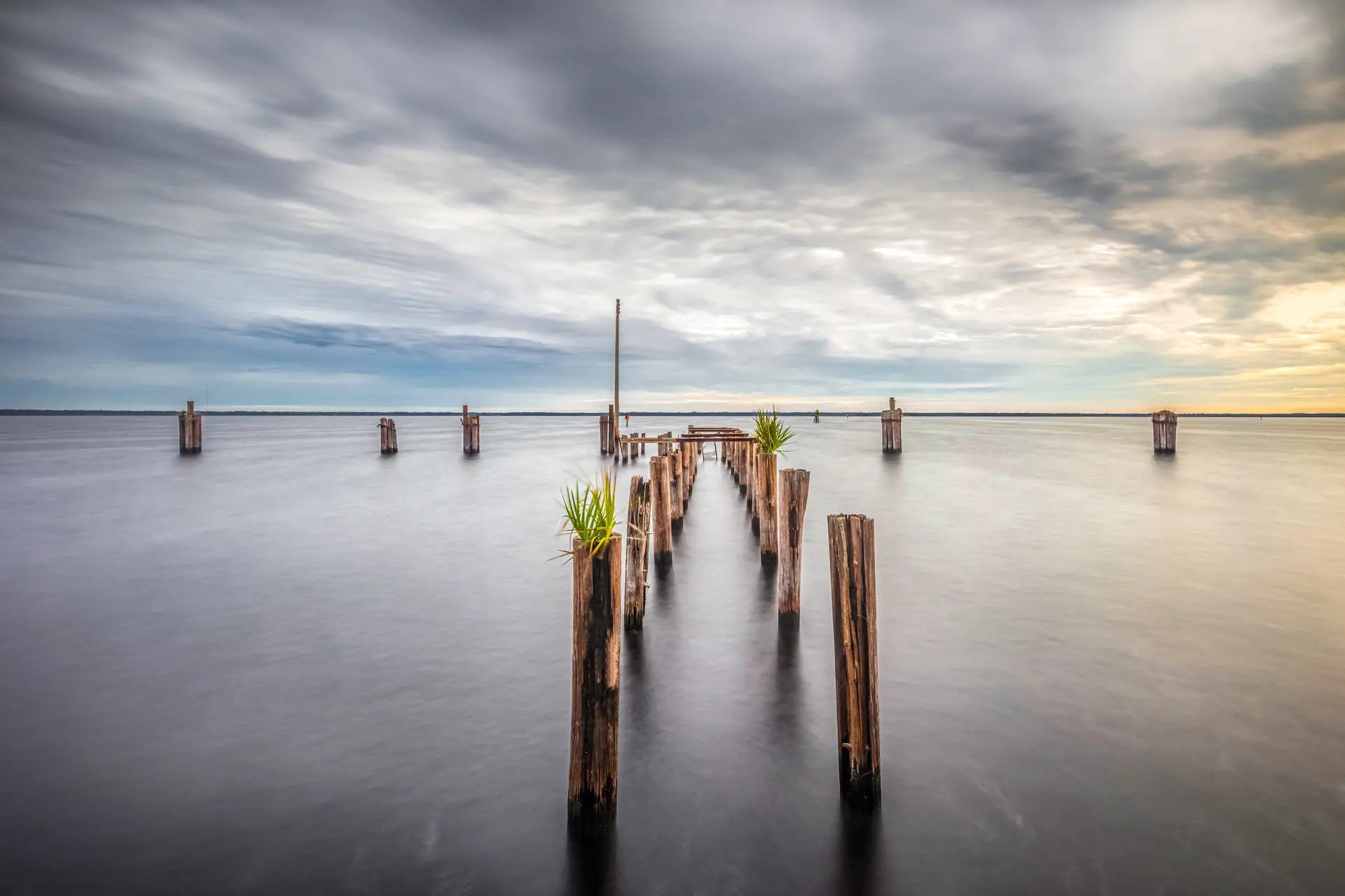 Serene pier extending into calm water