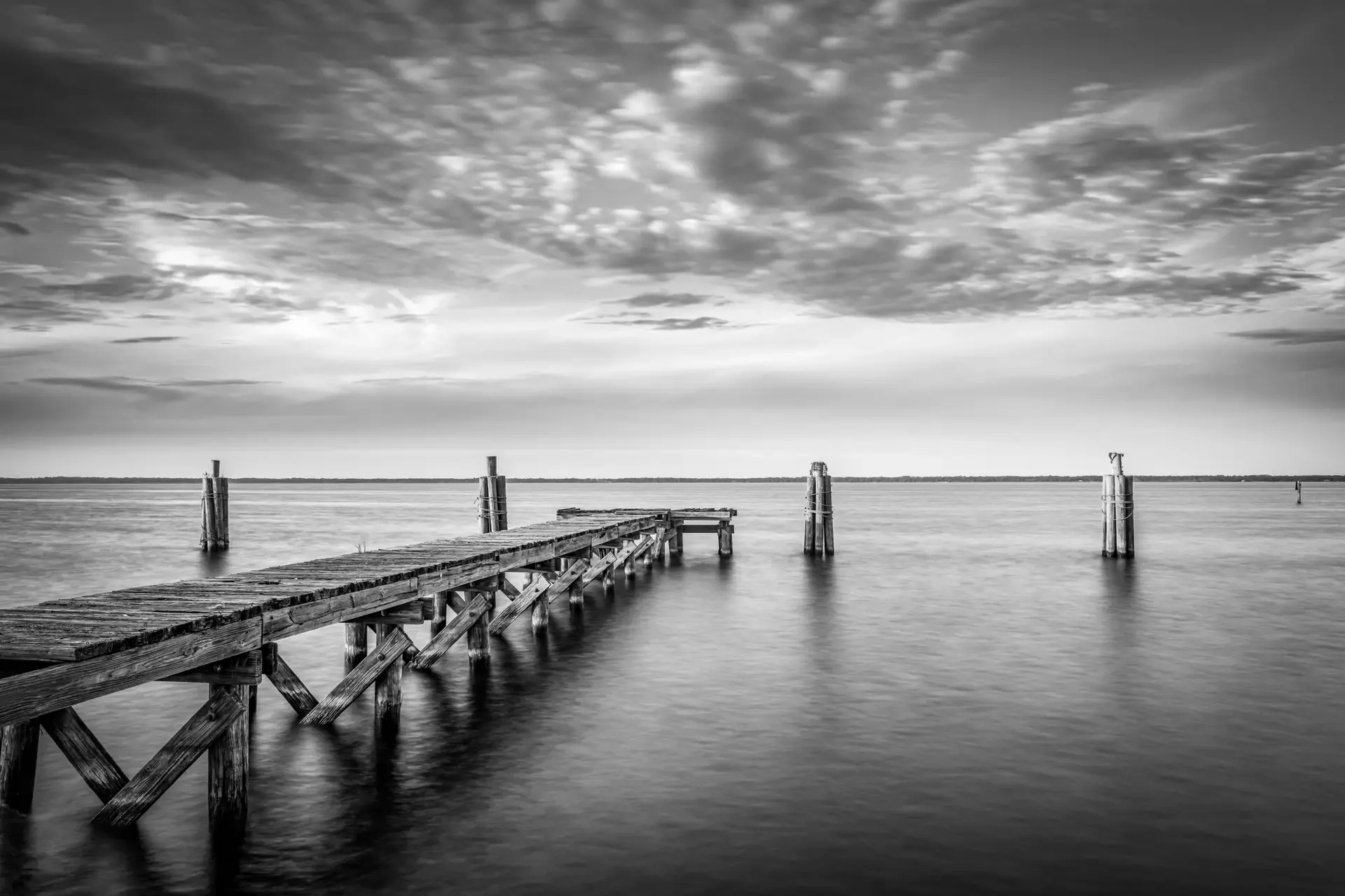 Black and white serene pier scene