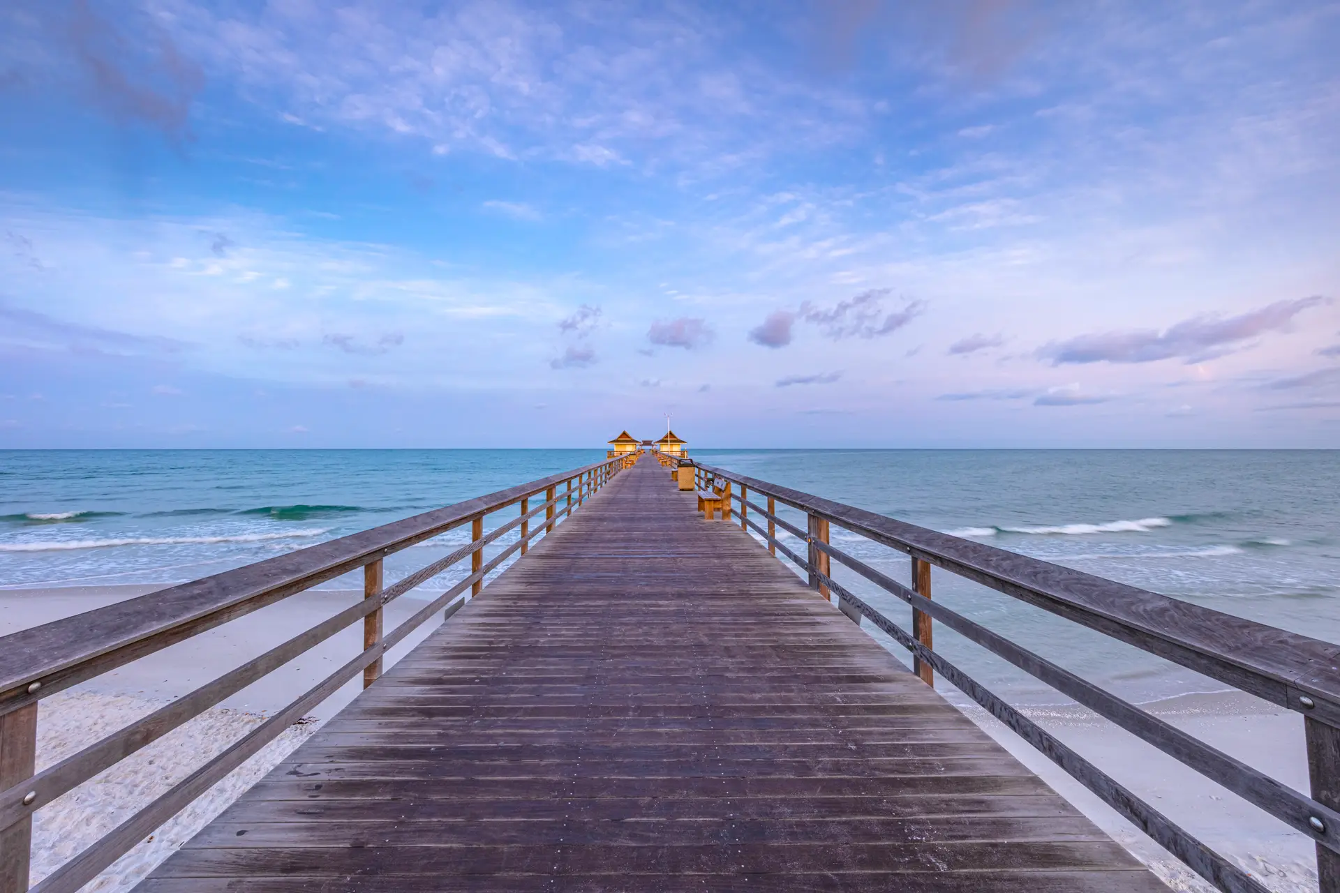Wooden pier extending into calm ocean