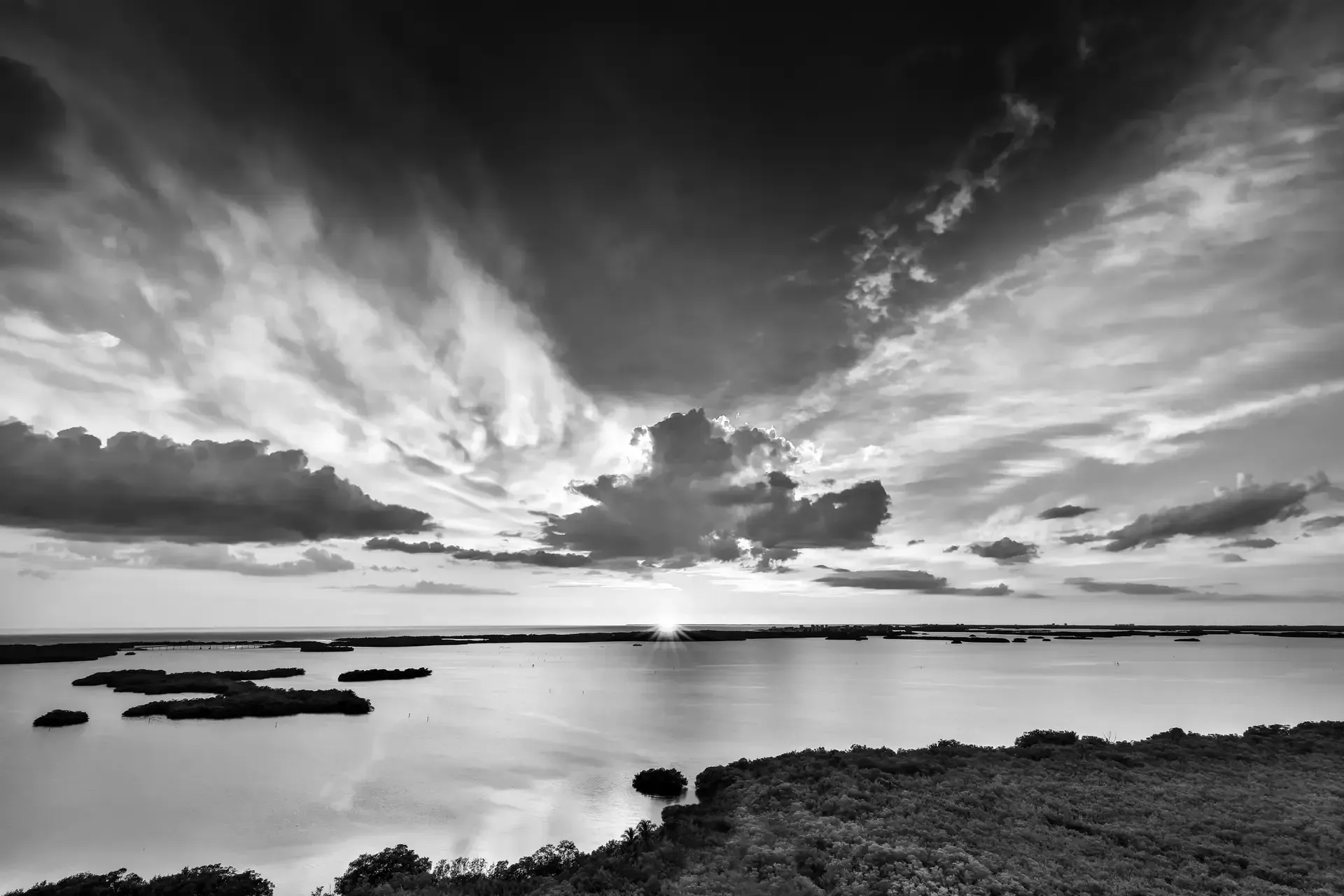 Black and white sunset over water