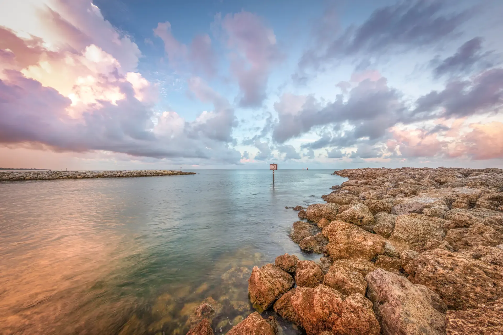 Serene coastal view at sunset.