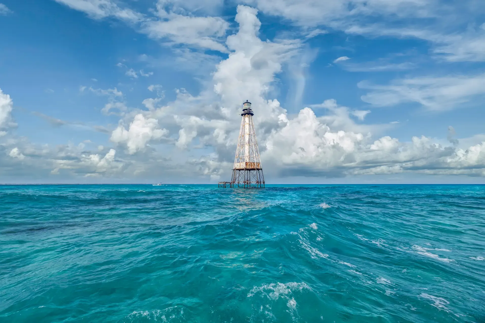 Lighthouse in vibrant blue ocean