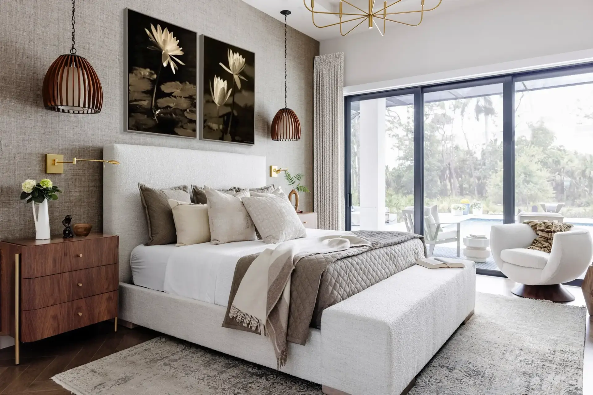 Bright modern bedroom with neutral tones and large window.