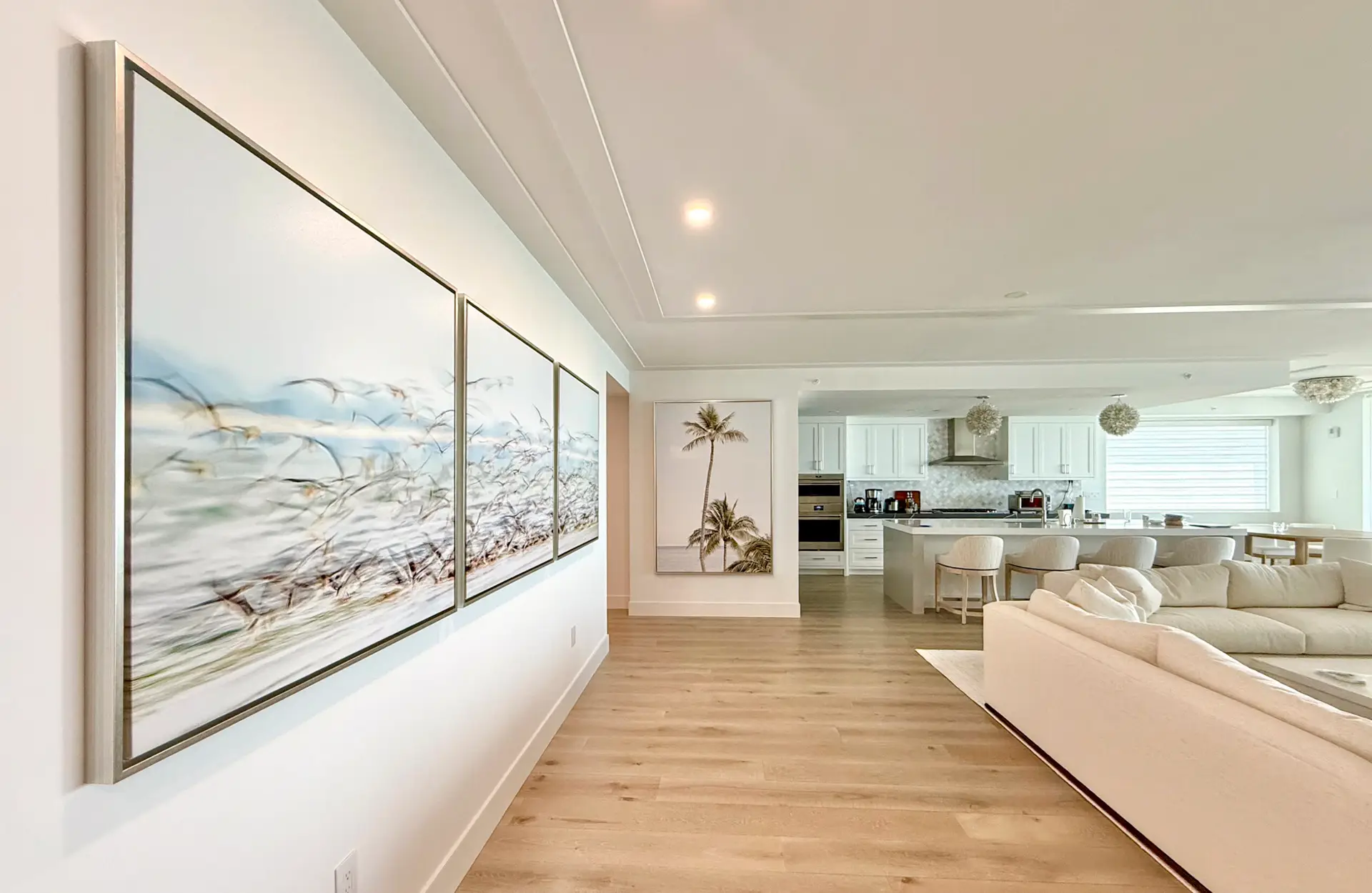 Bright modern living room with large windows and scenic views.