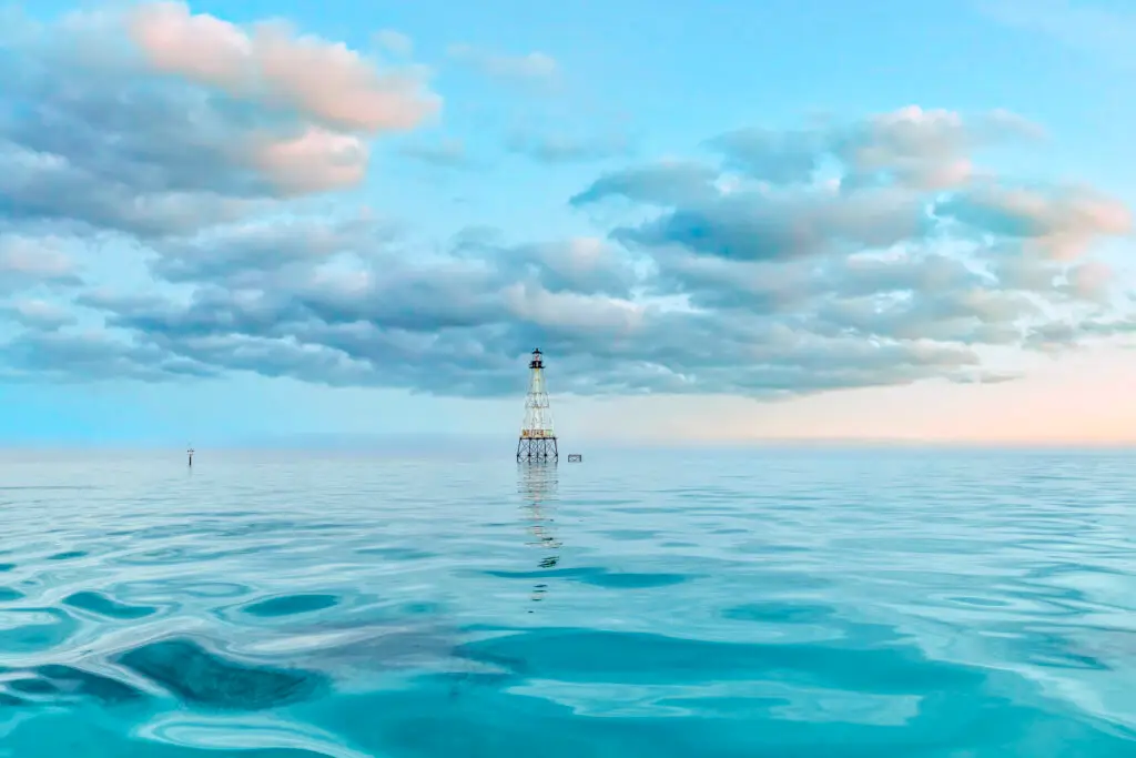 Lighthouse in calm turquoise waters