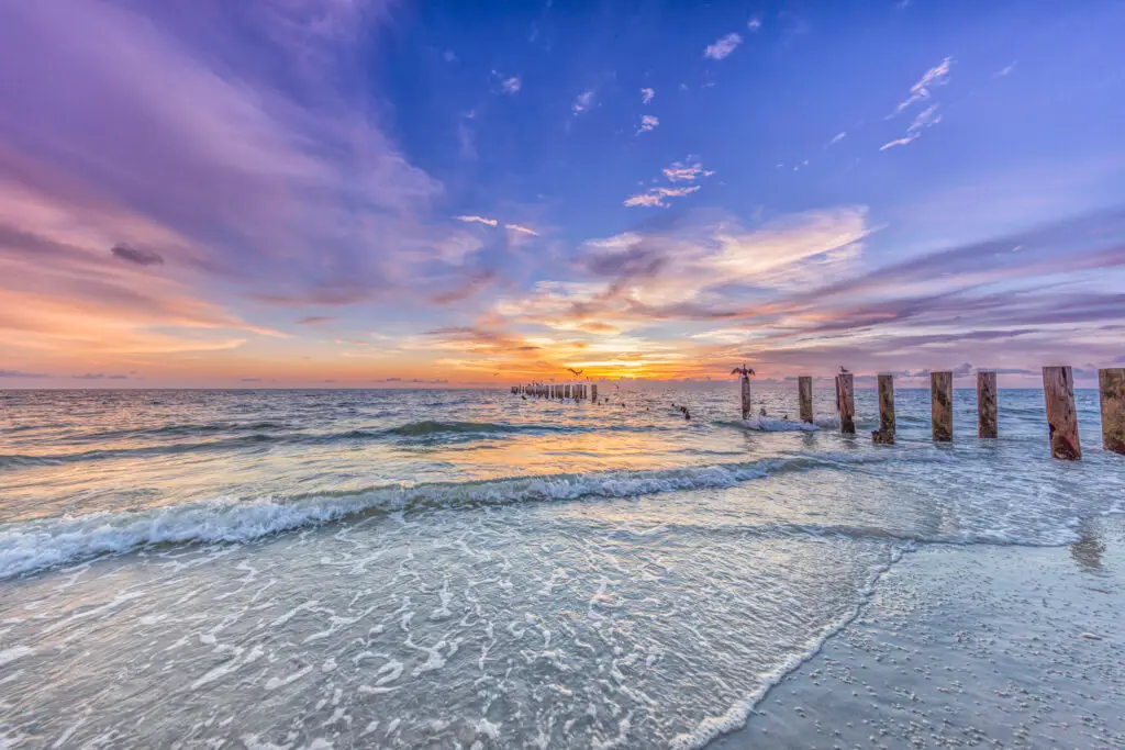 Sunset over calm ocean waves