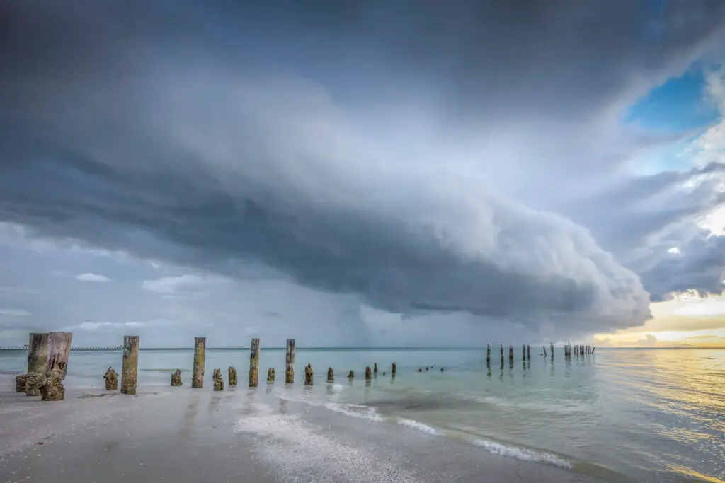 Stormy clouds over calm ocean waters
