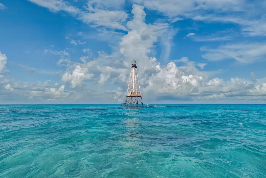 Lighthouse in vibrant blue ocean