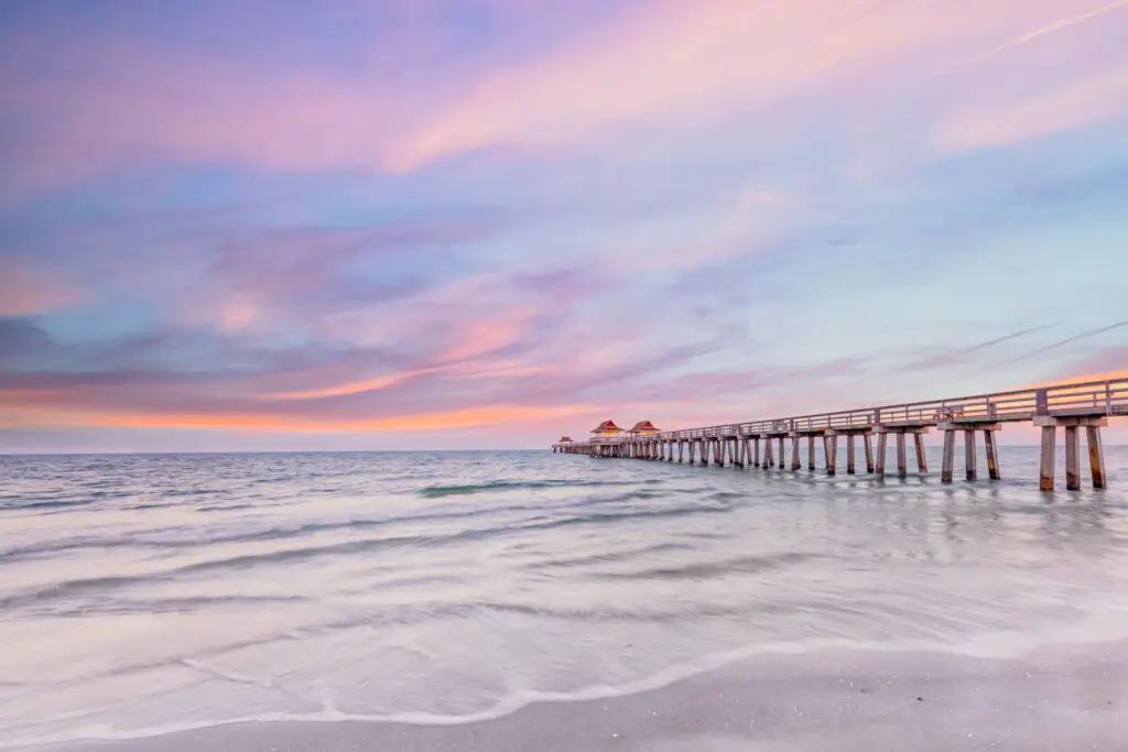 Serene pier at sunset over water